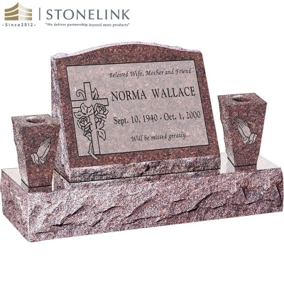 Granite slant headstone with vases