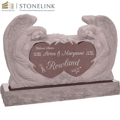 Kneeling angels embracing double heart granite headstone